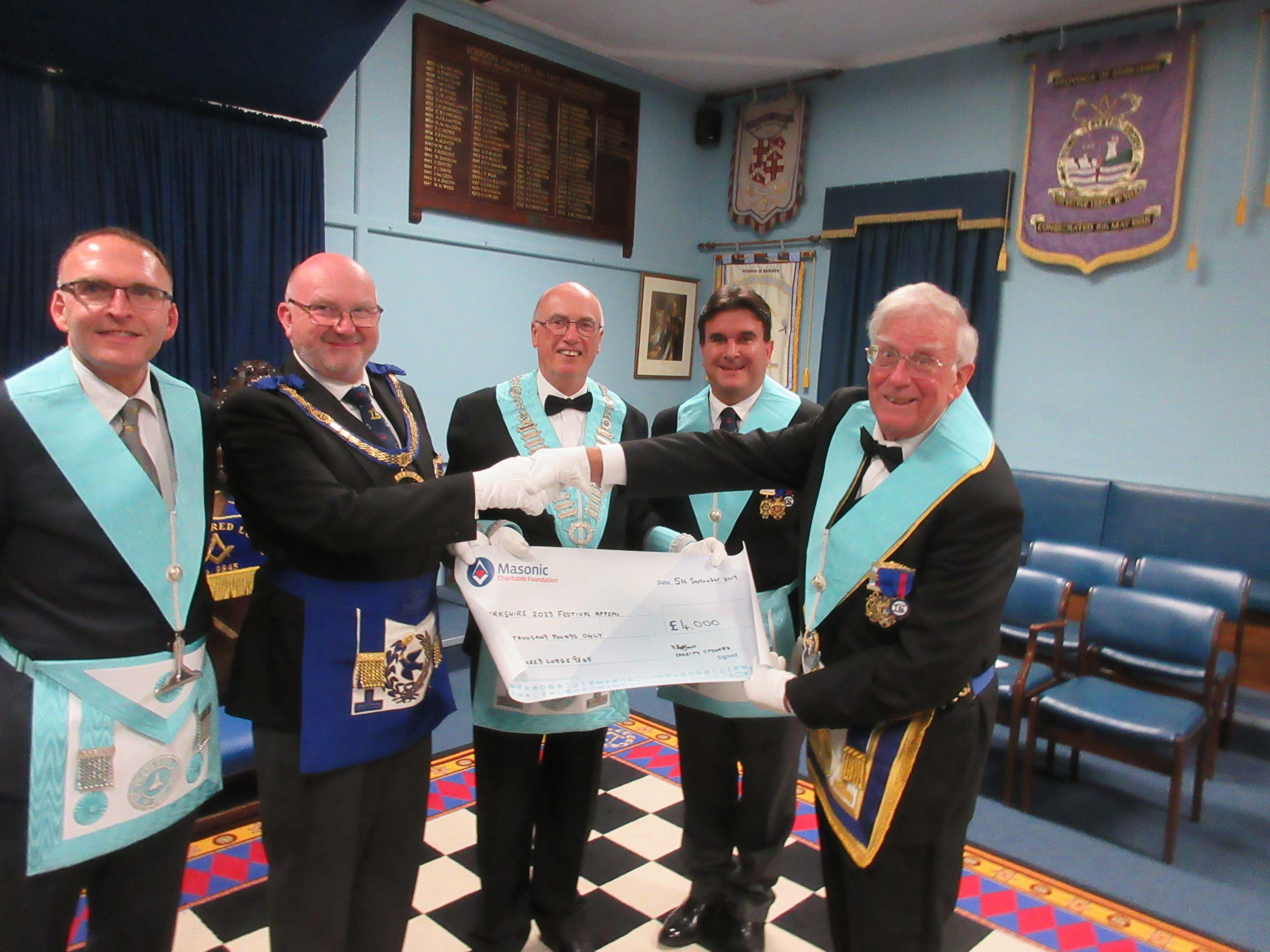 Cheque Presentation for £4,000 in aid of the Provincial 2023 Festival Appeal. Present are Bro. Terry Clark (JW), W.Bro. Robin Kent (APGM), W.Bro. Michael Hogg (WM), W.Bro. Mark Davis (SW) and W.Bro. David Matthews (CStwd) Cheque Presenation